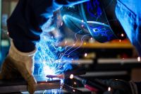 Welding safety gear including a helmet and gloves