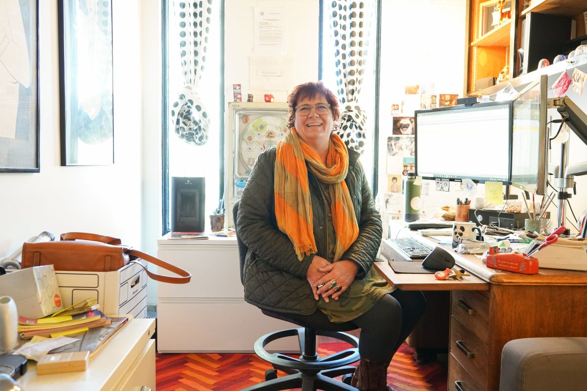 Renee Ventimiglia, Crucible CFO and Interim ED, sits at her desk in her office