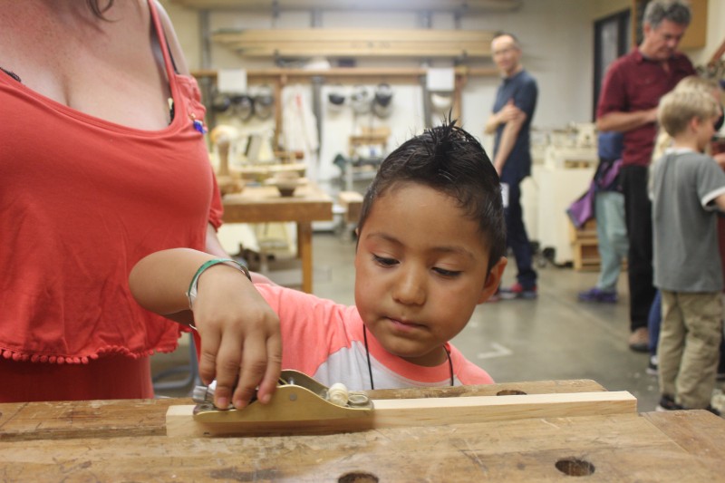 Fire and Water Open House_ August 2018_ Woodworking kid named Chris age 5 with mom demo_1097